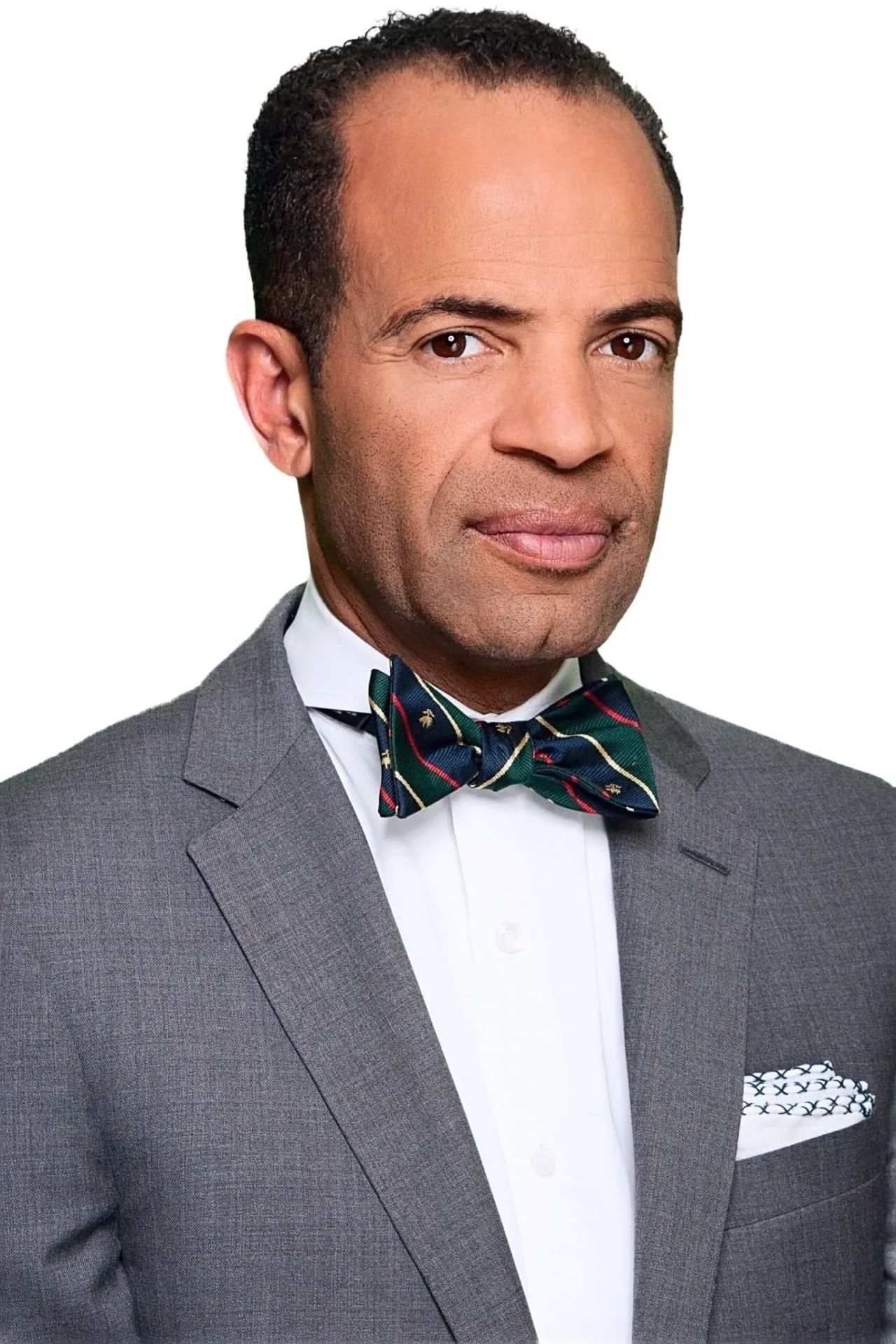 A man in a suit and bow tie.