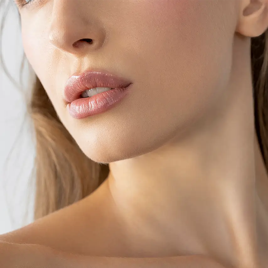 woman with full natural lips and smooth facial features